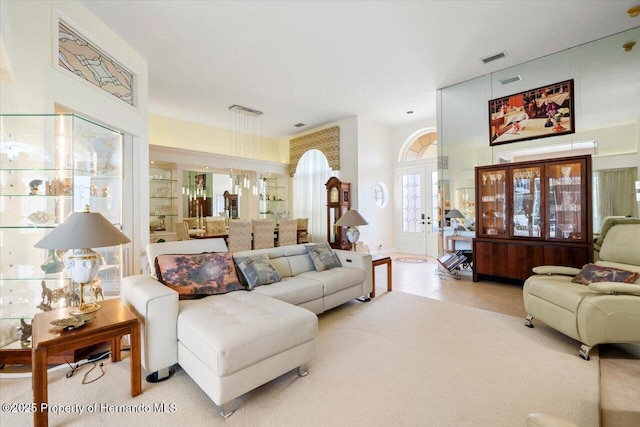 9161 Southern Comfort Ct, Weeki Wachee, FL 34613 - living area with french doors and carpet floors