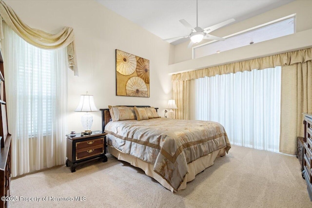 9161 Southern Comfort Ct, Weeki Wachee, FL 34613 - bedroom featuring light colored carpet and ceiling fan