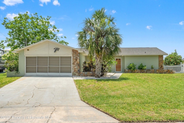 3226 Gardenia Dr, Hernando Beach, FL 34607 - view of front of home featuring driveway, stone siding, a garage, and stucco siding