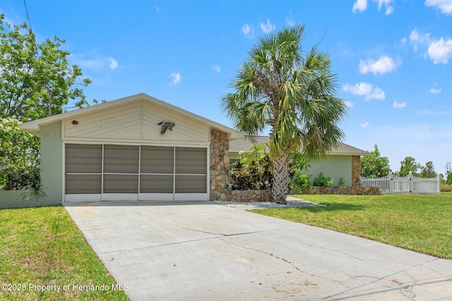 3226 Gardenia Dr, Hernando Beach, FL 34607 - view of front of property with stucco siding, stone siding, concrete driveway, and a garage