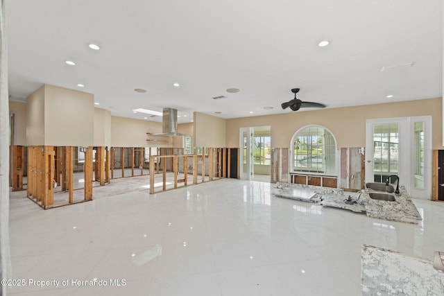 3226 Gardenia Dr, Hernando Beach, FL 34607 - tiled living room with ceiling fan, recessed lighting, and a sink