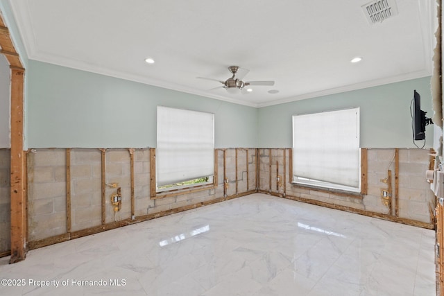 3226 Gardenia Dr, Hernando Beach, FL 34607 - unfurnished room featuring plenty of natural light, marble tiled floors, a ceiling fan, a wainscoted wall, and recessed lighting