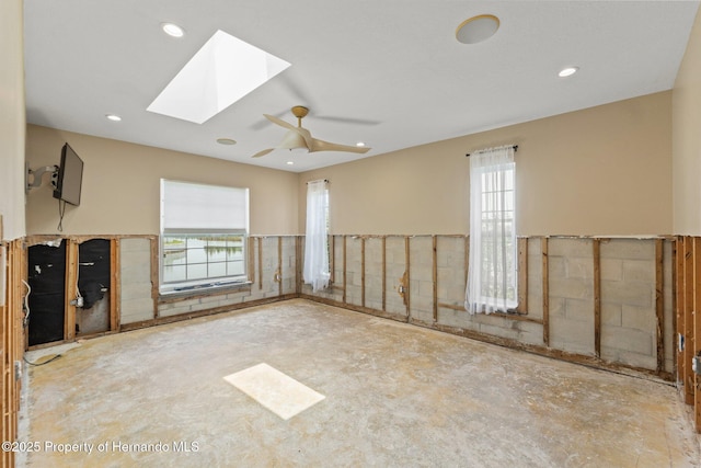 3226 Gardenia Dr, Hernando Beach, FL 34607 - unfurnished room featuring a skylight, recessed lighting, ceiling fan, and unfinished concrete flooring