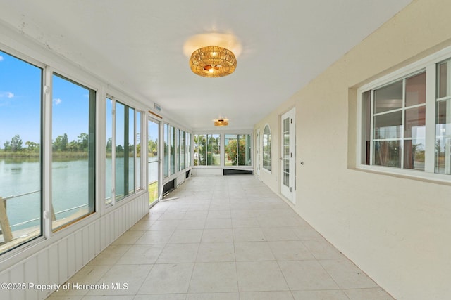 3226 Gardenia Dr, Hernando Beach, FL 34607 - unfurnished sunroom with a water view and tile patterned floors