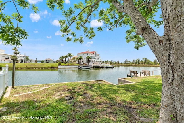 3226 Gardenia Dr, Hernando Beach, FL 34607 - dock featuring a water view and a lawn