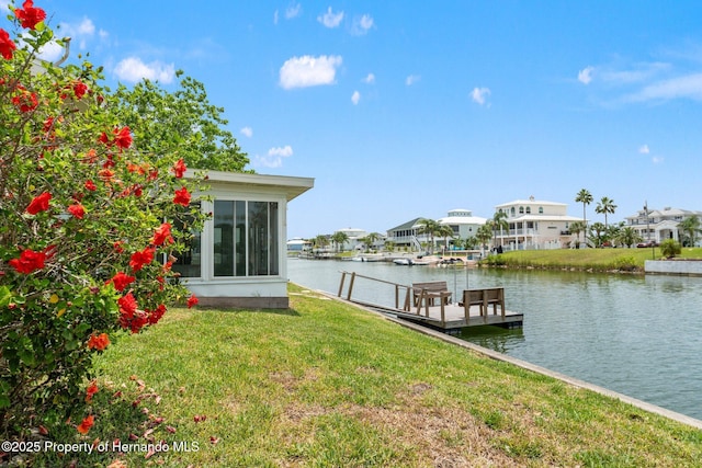 3226 Gardenia Dr, Hernando Beach, FL 34607 - dock with a lawn, a water view, and a residential view