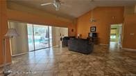 455 Cressida Cir, Spring Hill, FL 34609 - living area featuring a ceiling fan and vaulted ceiling