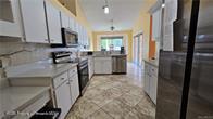 455 Cressida Cir, Spring Hill, FL 34609 - kitchen with stainless steel range with electric stovetop