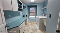 455 Cressida Cir, Spring Hill, FL 34609 - laundry room featuring independent washer and dryer and cabinet space