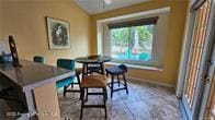 455 Cressida Cir, Spring Hill, FL 34609 - dining room with baseboards and vaulted ceiling