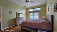 455 Cressida Cir, Spring Hill, FL 34609 - bedroom featuring lofted ceiling and baseboards