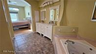 455 Cressida Cir, Spring Hill, FL 34609 - full bathroom with a whirlpool tub