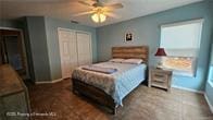455 Cressida Cir, Spring Hill, FL 34609 - bedroom with baseboards, a closet, ceiling fan, and multiple windows