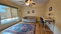 455 Cressida Cir, Spring Hill, FL 34609 - living room featuring healthy amount of natural light, ceiling fan, and baseboards