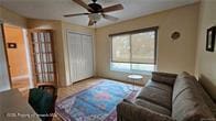 455 Cressida Cir, Spring Hill, FL 34609 - living room featuring ceiling fan