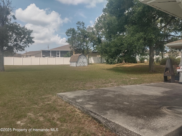12132 Norvell Rd, Spring Hill, FL 34609 - view of yard with a storage unit and a patio