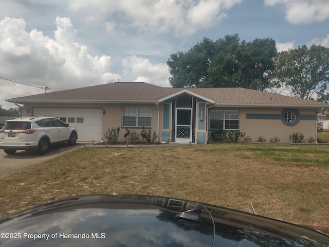 12132 Norvell Rd, Spring Hill, FL 34609 - view of front facade with stucco siding, a front yard, a garage, and concrete driveway