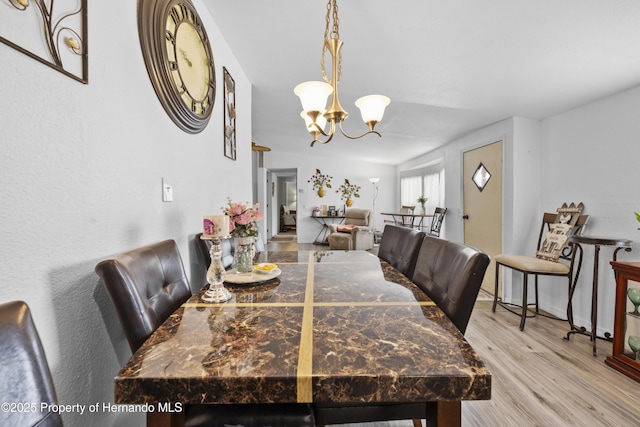 16040 Platinum Dr, Spring Hill Pasco, FL 34610 - dining area featuring a chandelier and wood finished floors