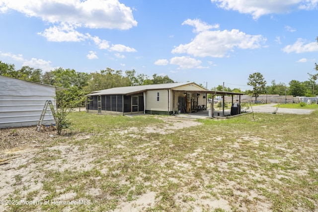 16040 Platinum Dr, Spring Hill Pasco, FL 34610 - rear view of property with a sunroom
