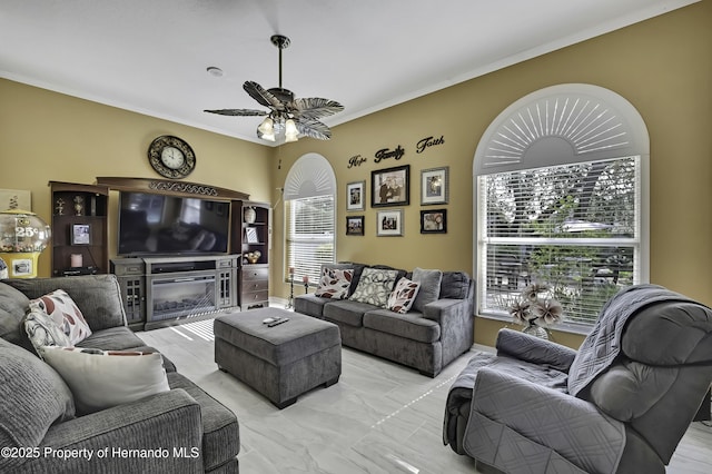 1086 Hook Dr, Spring Hill, FL 34608 - living area with a ceiling fan, ornamental molding, and light marble finish flooring