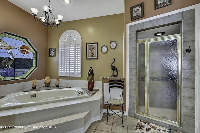 1086 Hook Dr, Spring Hill, FL 34608 - bathroom with tile patterned floors, a garden tub, a stall shower, and a chandelier