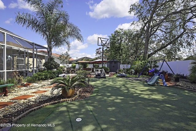 1086 Hook Dr, Spring Hill, FL 34608 - view of sport court featuring a storage shed and a playground