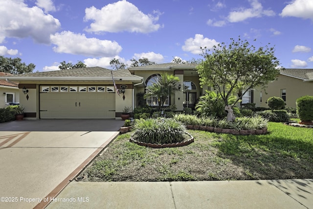 1086 Hook Dr, Spring Hill, FL 34608 - view of front facade featuring an attached garage, concrete driveway, and stucco siding