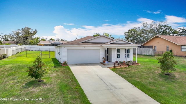 277 Hampshire Ave, Spring Hill, FL 34606 - single story home featuring a garage, driveway, and roof with shingles