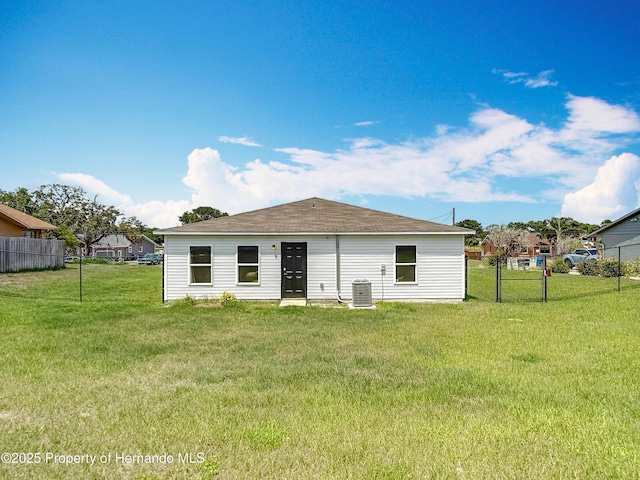 277 Hampshire Ave, Spring Hill, FL 34606 - rear view of house with roof with shingles and central air condition unit