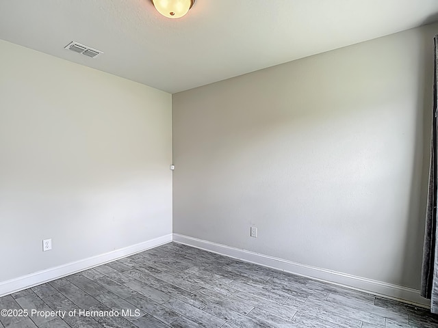 277 Hampshire Ave, Spring Hill, FL 34606 - spare room with wood finished floors and baseboards