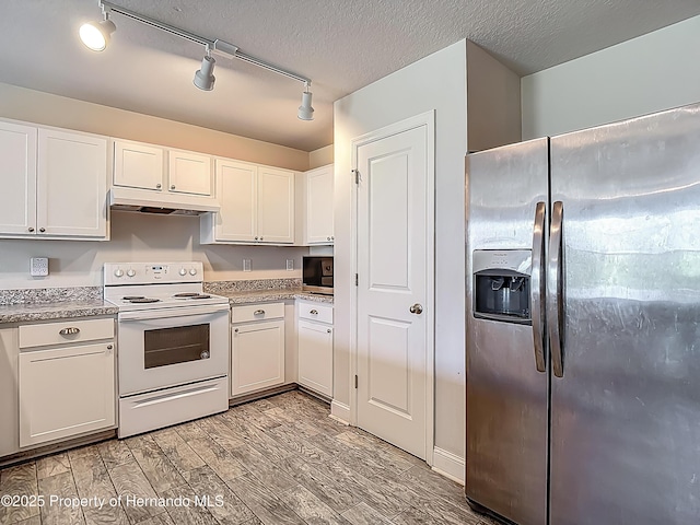 277 Hampshire Ave, Spring Hill, FL 34606 - kitchen featuring stainless steel fridge, white range with electric stovetop, under cabinet range hood, light wood-type flooring, and white cabinetry