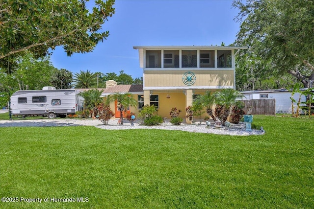 5507 Darlene St, Weeki Wachee, FL 34607 - view of front of house featuring a sunroom