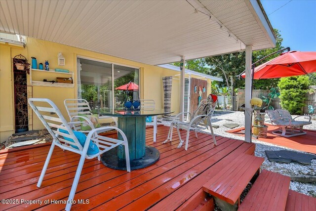 5507 Darlene St, Weeki Wachee, FL 34607 - deck with outdoor dining area