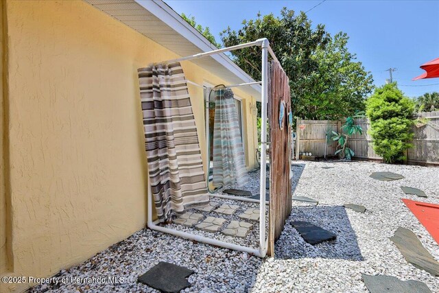 5507 Darlene St, Weeki Wachee, FL 34607 - view of side of property featuring stucco siding