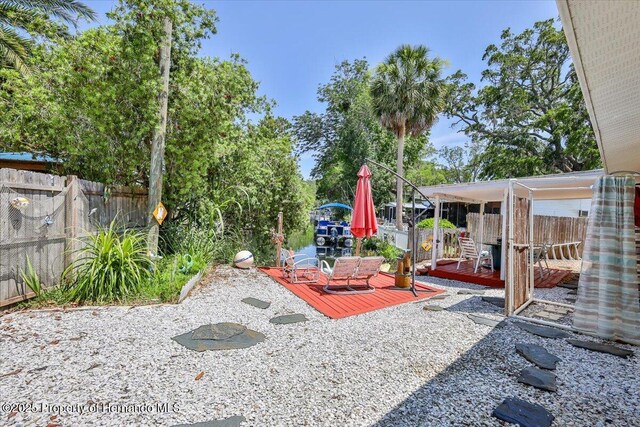 5507 Darlene St, Weeki Wachee, FL 34607 - fenced backyard with a deck
