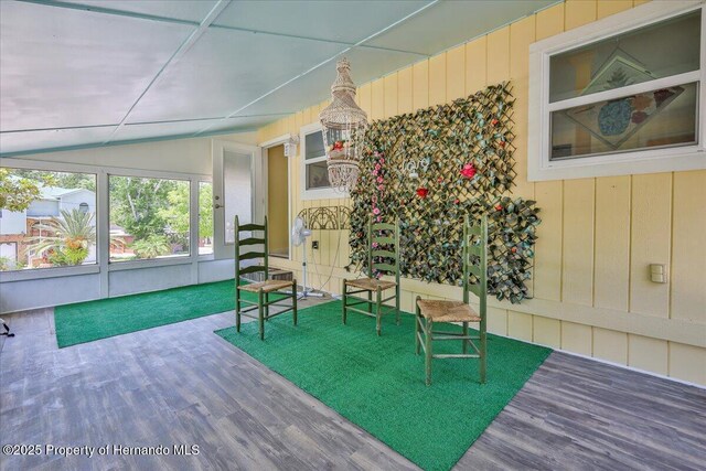 5507 Darlene St, Weeki Wachee, FL 34607 - sitting room featuring wood finished floors and vaulted ceiling