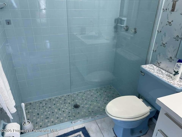 12801 Winding Way, Hudson, FL 34667 - bathroom featuring vanity, a tile shower, and toilet