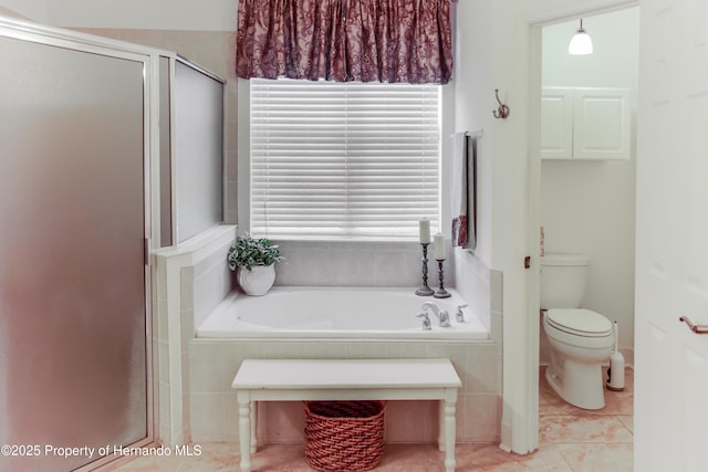 5233 Jennings Trl, Brooksville, FL 34601 - bathroom featuring a garden tub, a shower stall, toilet, and tile patterned floors