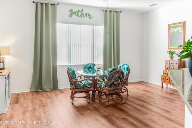 5233 Jennings Trl, Brooksville, FL 34601 - dining space featuring light wood-type flooring and baseboards