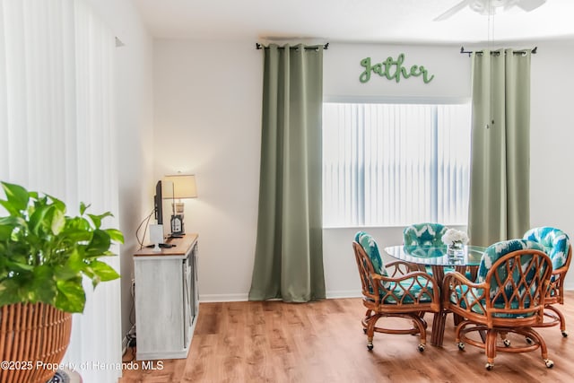 5233 Jennings Trl, Brooksville, FL 34601 - dining area featuring ceiling fan, wood finished floors, and baseboards