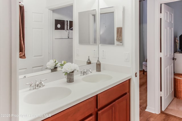 5233 Jennings Trl, Brooksville, FL 34601 - bathroom featuring double vanity and wood finished floors