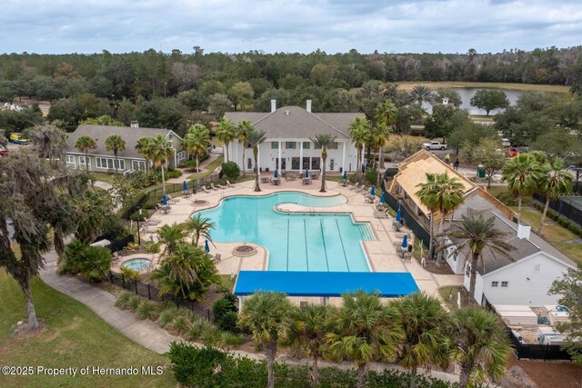 4056 Southern Valley Loop, Brooksville, FL 34601 - community pool with a patio, a wooded view, and a water view