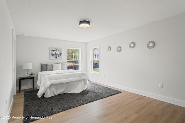 4522 Majestic Hills Loop, Brooksville, FL 34601 - bedroom featuring wood finished floors and baseboards