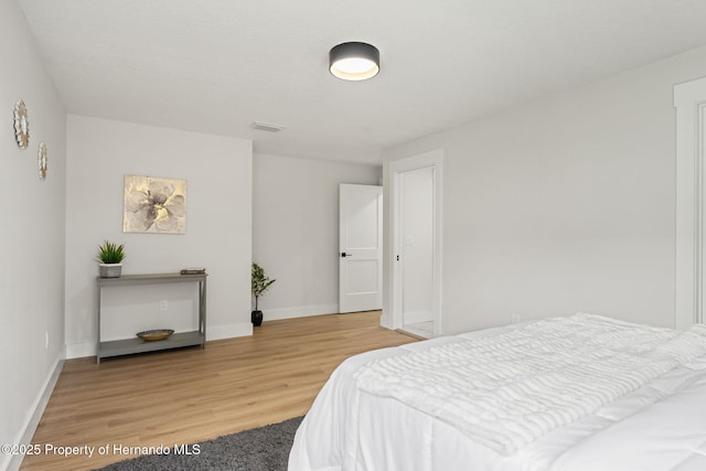 4522 Majestic Hills Loop, Brooksville, FL 34601 - bedroom with light wood-type flooring and baseboards