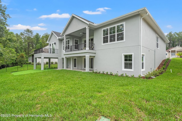 4522 Majestic Hills Loop, Brooksville, FL 34601 - rear view of property featuring a balcony, stucco siding, and a ceiling fan