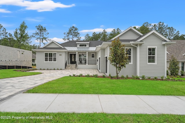 4522 Majestic Hills Loop, Brooksville, FL 34601 - view of front of home featuring a front lawn and stucco siding