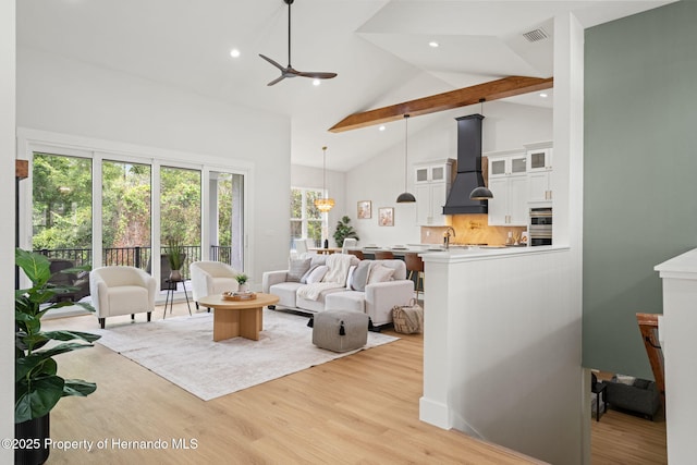 4522 Majestic Hills Loop, Brooksville, FL 34601 - living area featuring beamed ceiling, high vaulted ceiling, light wood-type flooring, ceiling fan, and recessed lighting