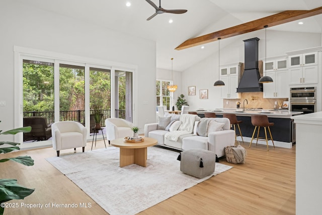 4522 Majestic Hills Loop, Brooksville, FL 34601 - living area with high vaulted ceiling, beam ceiling, light wood finished floors, recessed lighting, and ceiling fan