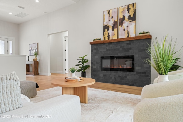 4522 Majestic Hills Loop, Brooksville, FL 34601 - living area with wood finished floors, recessed lighting, and a fireplace