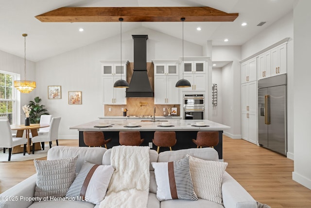 4522 Majestic Hills Loop, Brooksville, FL 34601 - living area featuring a chandelier, light wood-type flooring, beam ceiling, recessed lighting, and high vaulted ceiling